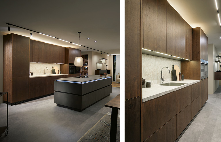 Warme Holztöne in Kombination mit coolem Design machen die Küche zu einem besonderen Wohn-Highlight.